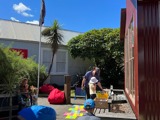 Activities and games for children on a sunny day outside Reefton Library 