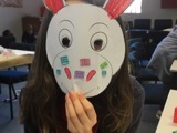 Child wearing a donkey mask